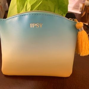 Cute mini card holder with gold designer name Kate Spade on the front